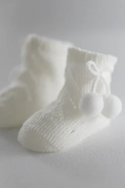Calcetines perlé con borlas recién nacido<Ysabel Mora Hot